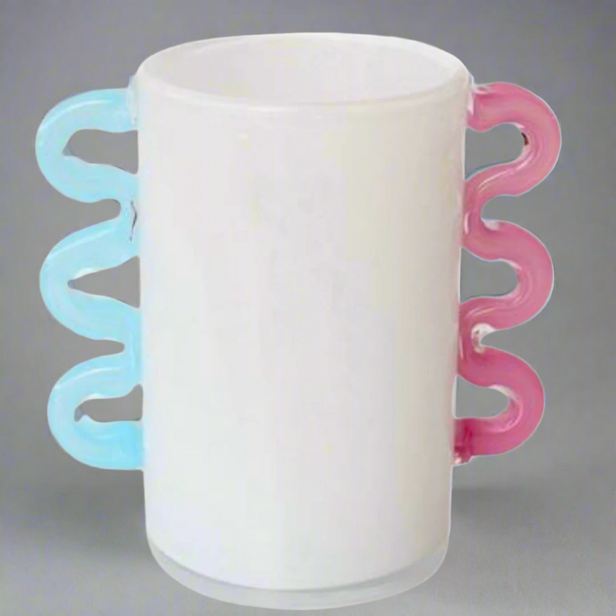 White Frosted Glass Vase with Pink &amp; Aqua Blue Handles
Add a touch of elegance to your home decor with this beautiful White Frosted Glass Vase, featuring delicate pink and aqua blue handles. Perfect for displaying flowers or as a standalone decorative piece.Unique Boys.