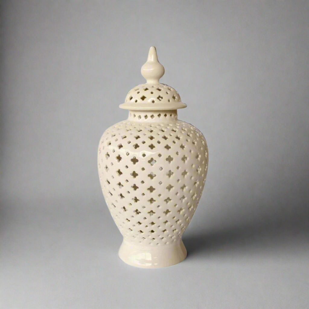 Elegant Statement Piece: White Large Cut-Out Ginger Jar
Elevate your home decor with the stunning White Large Cut-Out Ginger Jar, a beautifully handcrafted piece that combines elegance and sophistication. Measuring 50x24cm, this jar features an intricate cut-out design that adds visual interest and texture, creating beautiful light patterns and shadows. Its timeless white finish makes it a perfect fit for various decor styles, from modern to traditional.www.uniqueboys.co.za