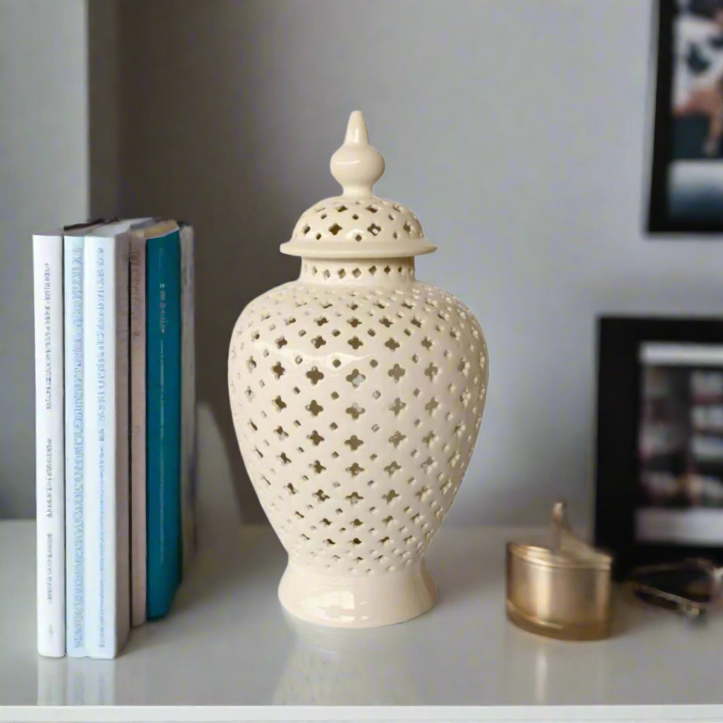 Elegant Statement Piece: White Large Cut-Out Ginger Jar
Elevate your home decor with the stunning White Large Cut-Out Ginger Jar, a beautifully handcrafted piece that combines elegance and sophistication. Measuring 50x24cm, this jar features an intricate cut-out design that adds visual interest and texture, creating beautiful light patterns and shadows. Its timeless white finish makes it a perfect fit for various decor styles, from modern to traditional.www.uniqueboys.co.za