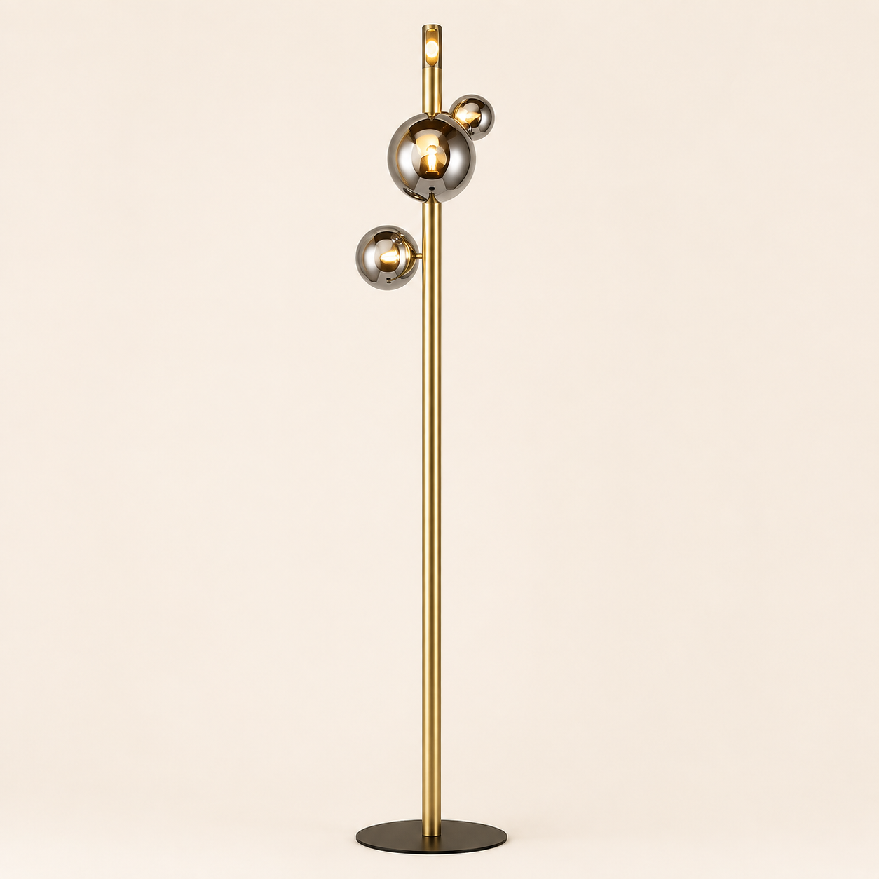 Add contemporary elegance with the Yoyo Floor Lamp, featuring a sleek gold stem and reflective globe details.