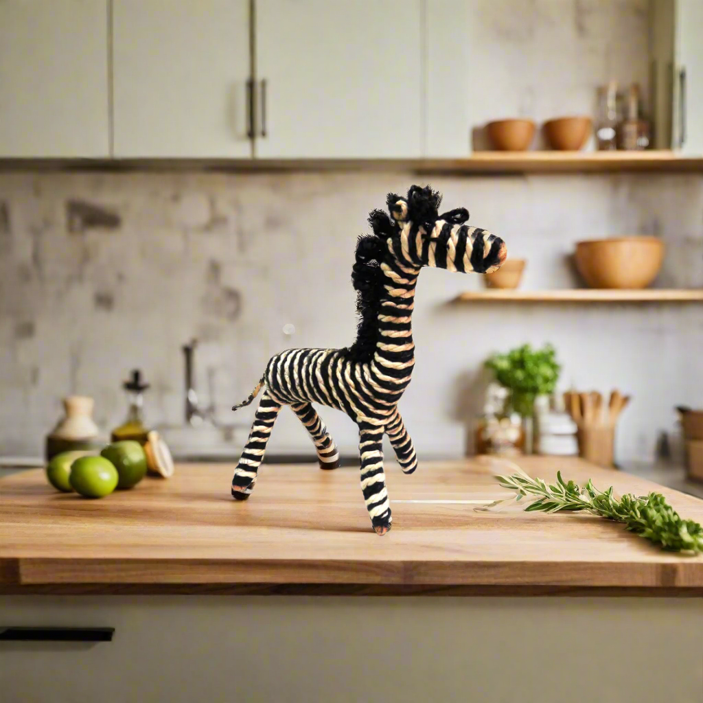 Product Description: Handmade Zebra
Add a touch of whimsy to your home with this charming handmade Zebra decorative piece. Crafted from natural jute sisal and cotton, this unique piece stands 17cm x 19cm tall and boasts a naive and quirky design.