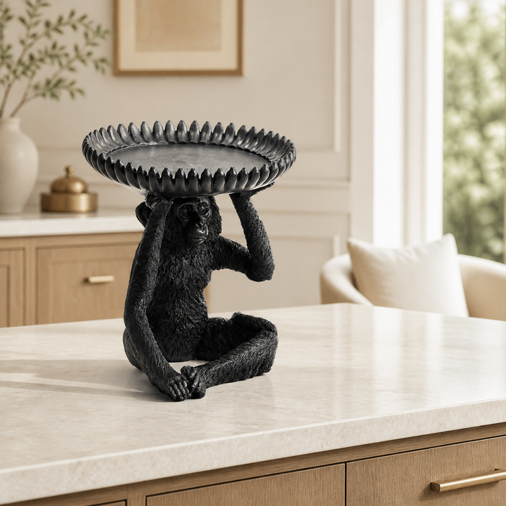 Large black resin monkey banana bowl in luxury interior