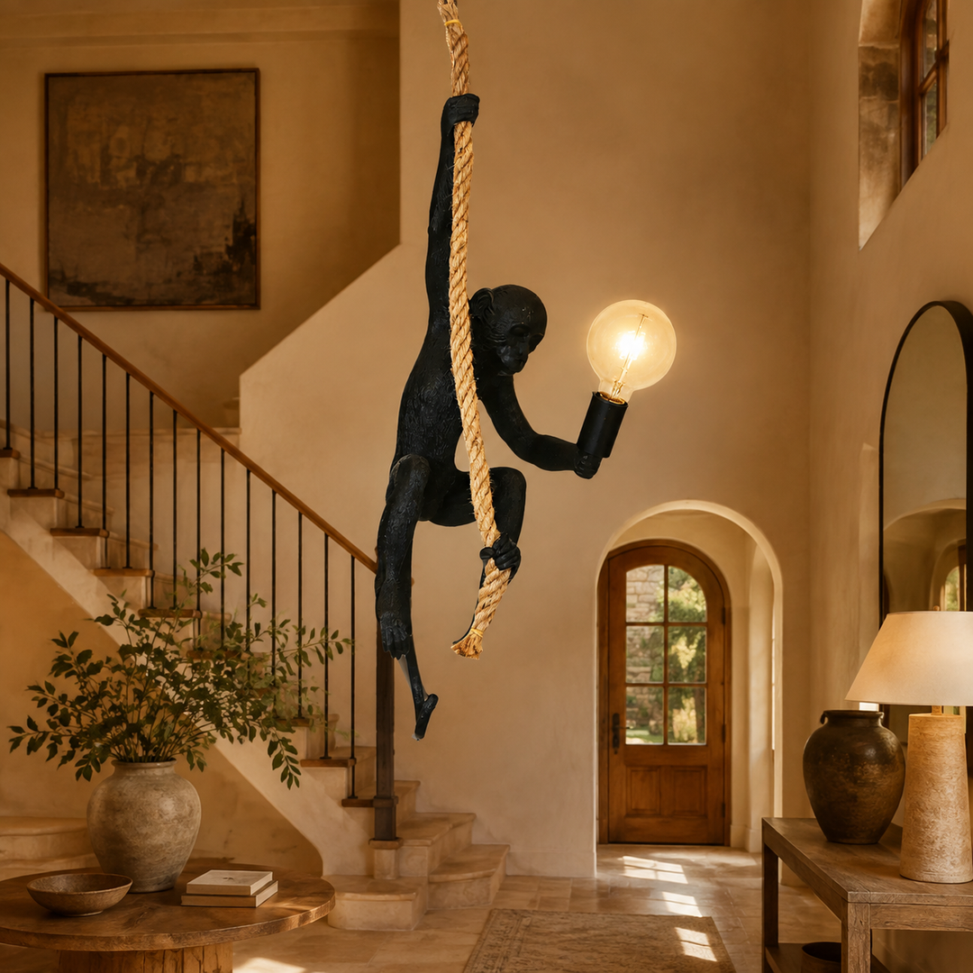 Black resin monkey on rope hanging lamp in warm luxury interior