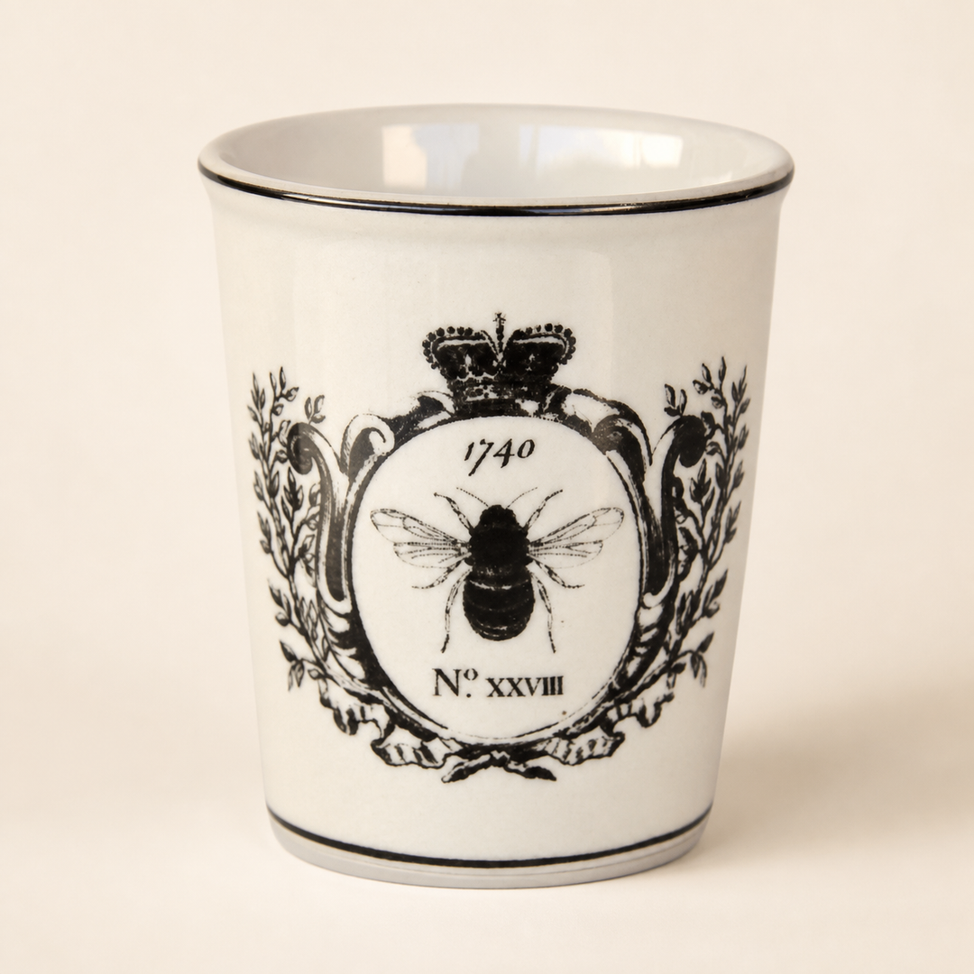 Black and white bee beaker on a warm ivory catalogue background