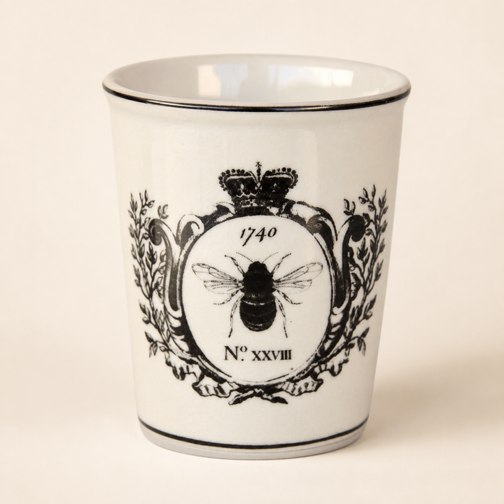 Black and white bee beaker on a warm ivory catalogue background