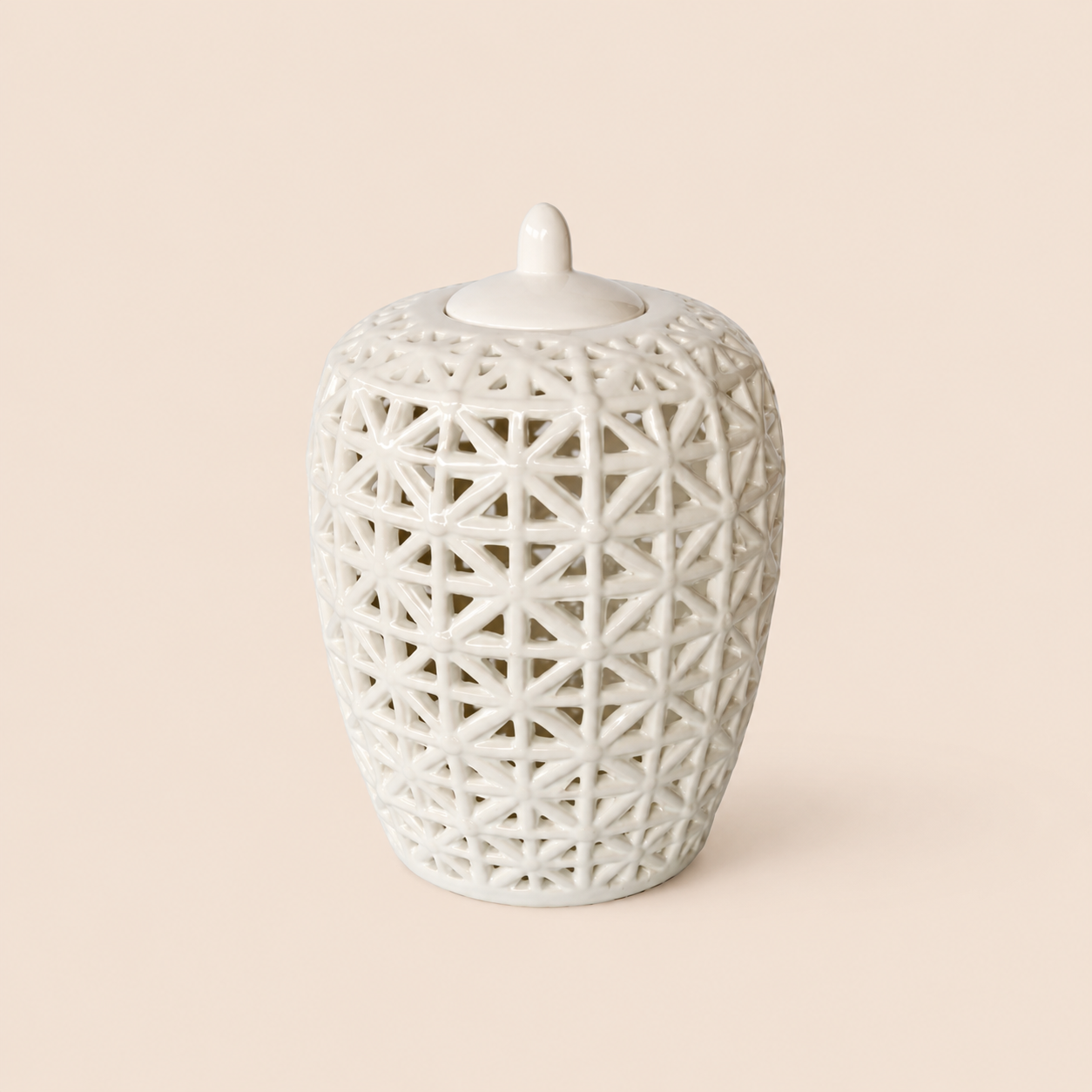 White fat criss-cross cut-out jar with lid on warm beige background