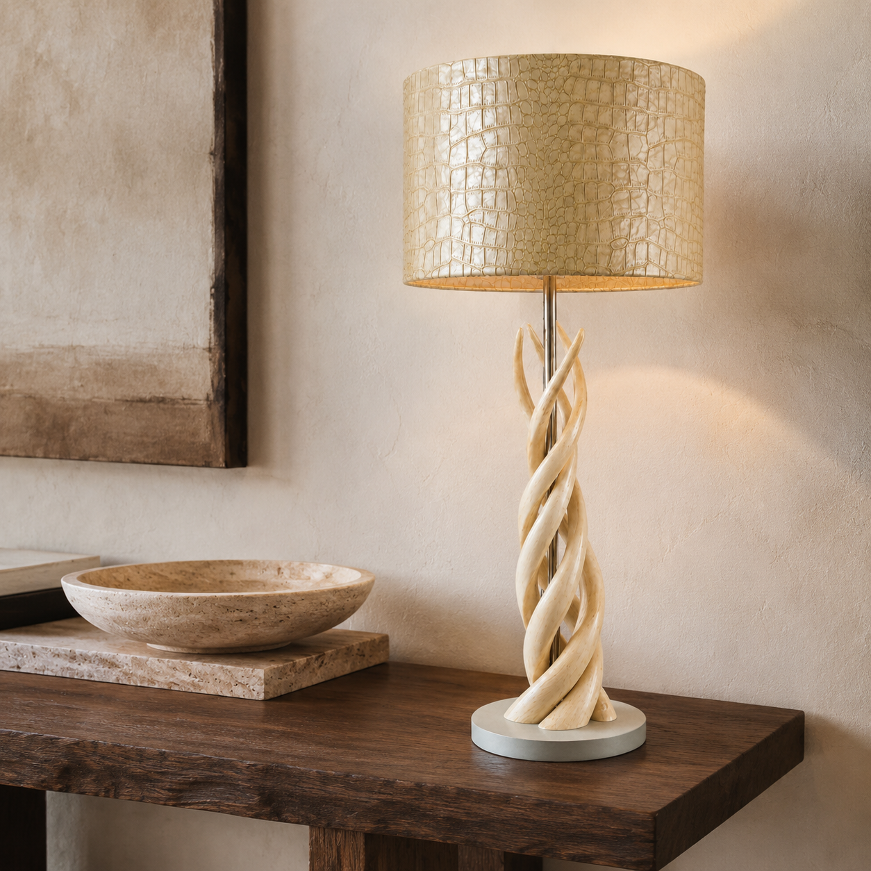 Four natural kudu horn upright twist lamp styled on a dark walnut console in a refined neutral interior