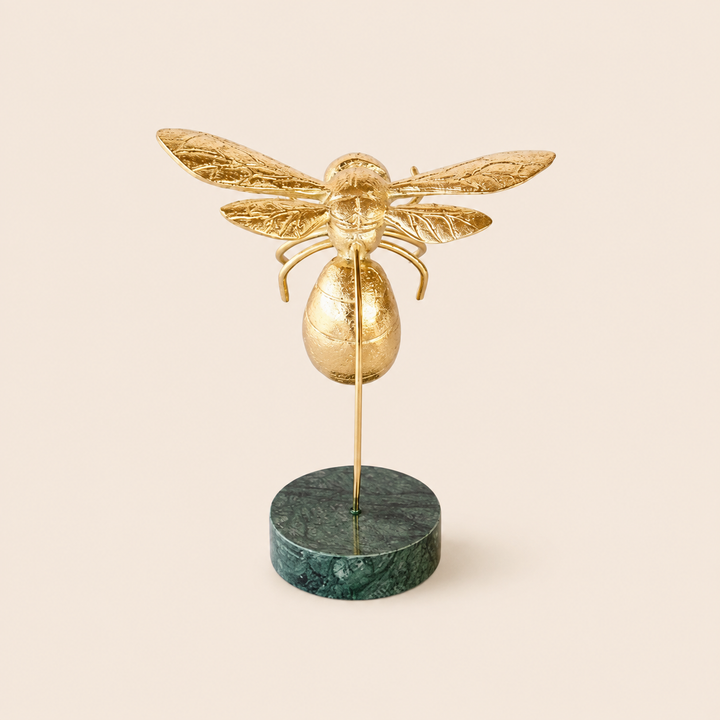 Gold bumblebee on dark green marble base – catalogue view