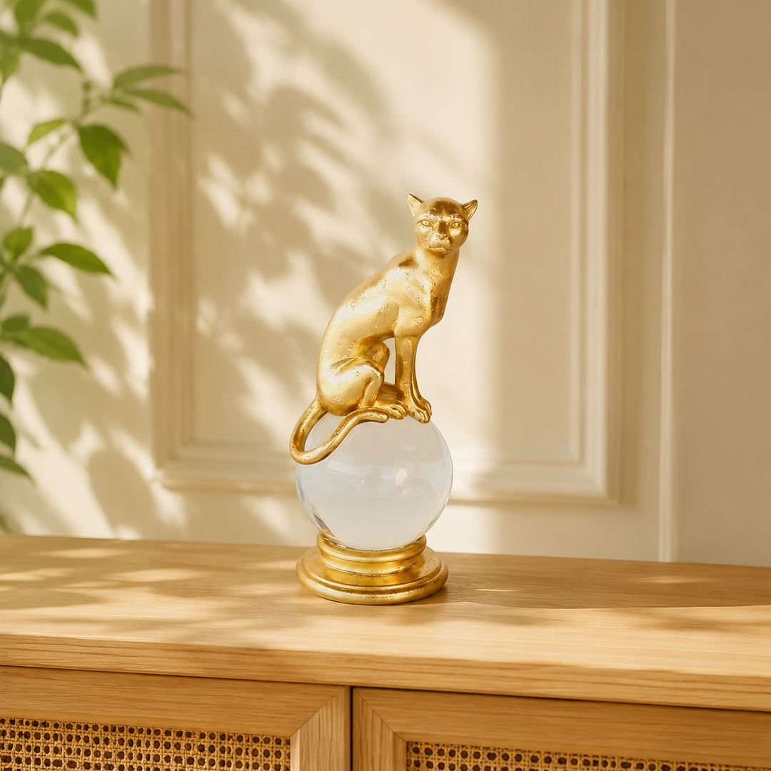 Gold leopard on glass ball styled in a warm interior