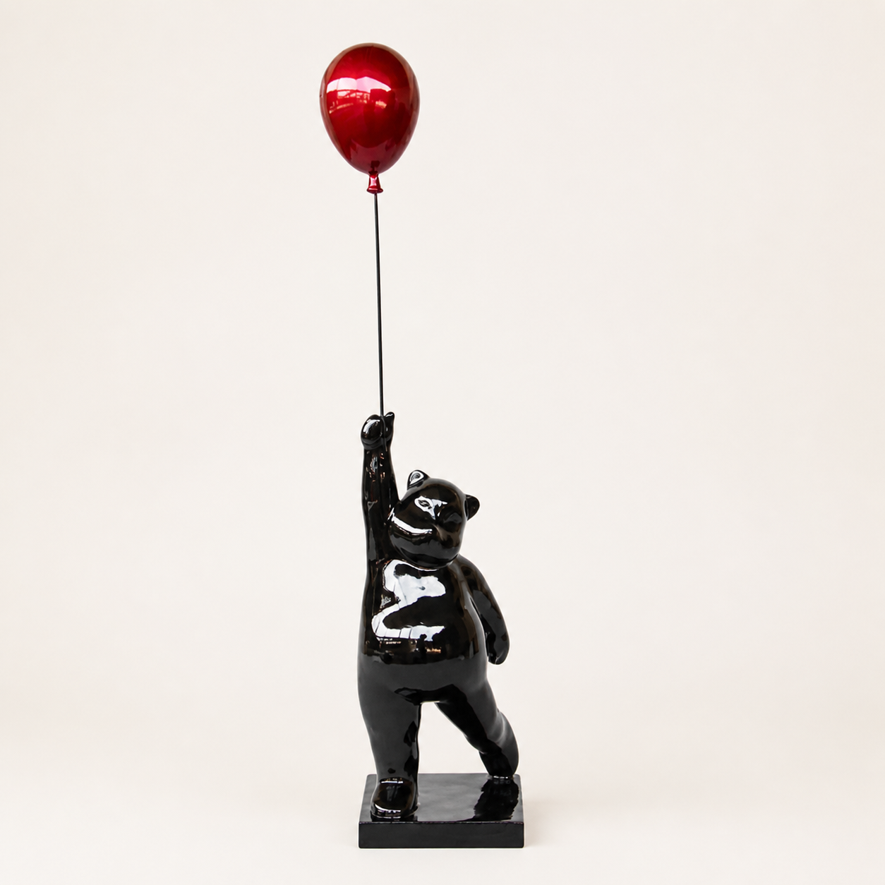 Large black bear holding red balloon - catalogue