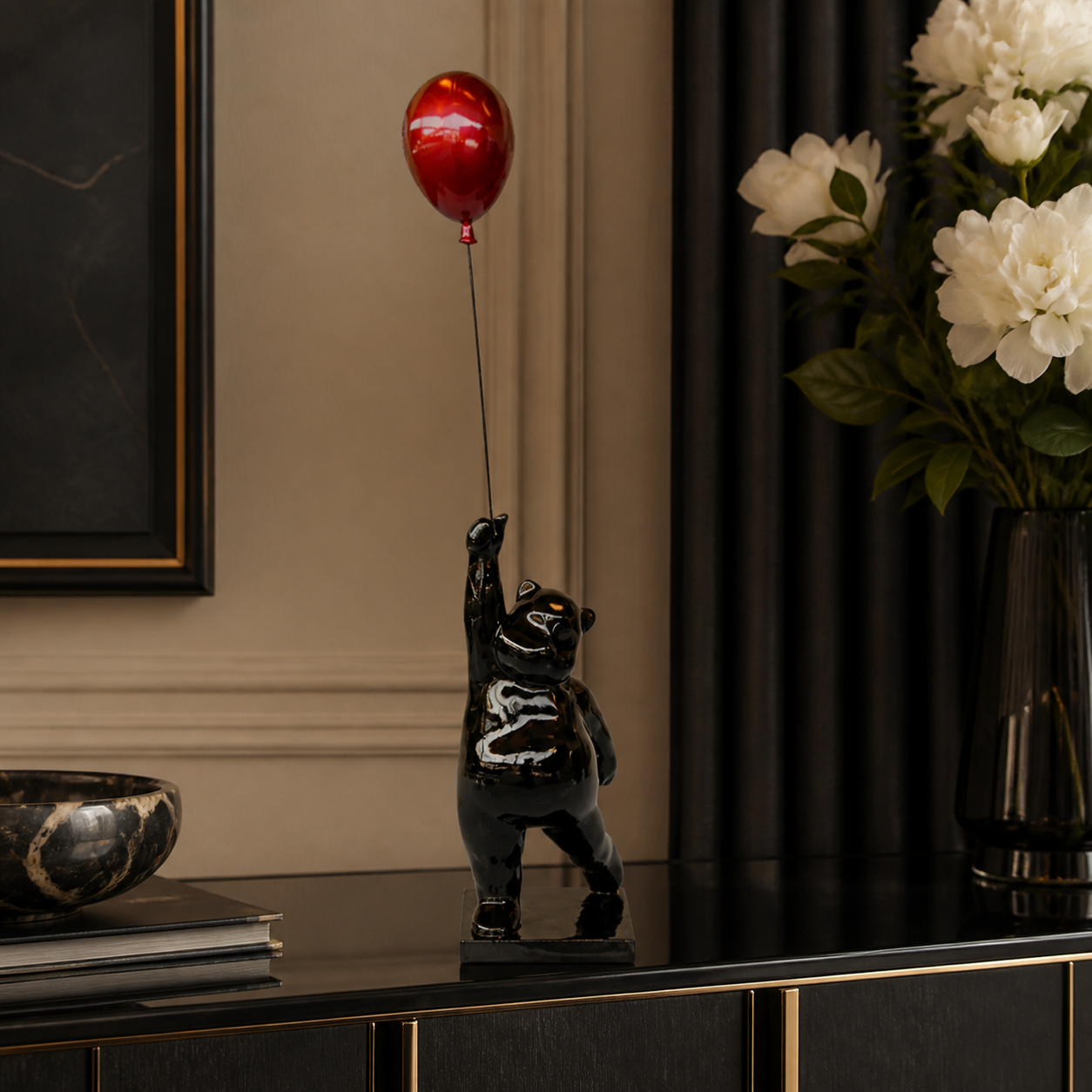 Large black bear holding red balloon - luxury lifestyle