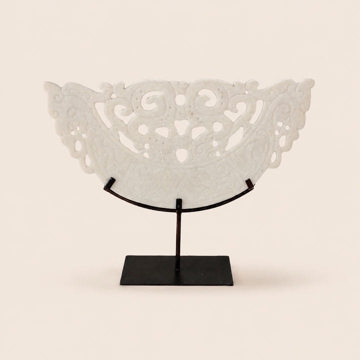Large white cut-out sandstone sculpture on metal stand – catalogue view