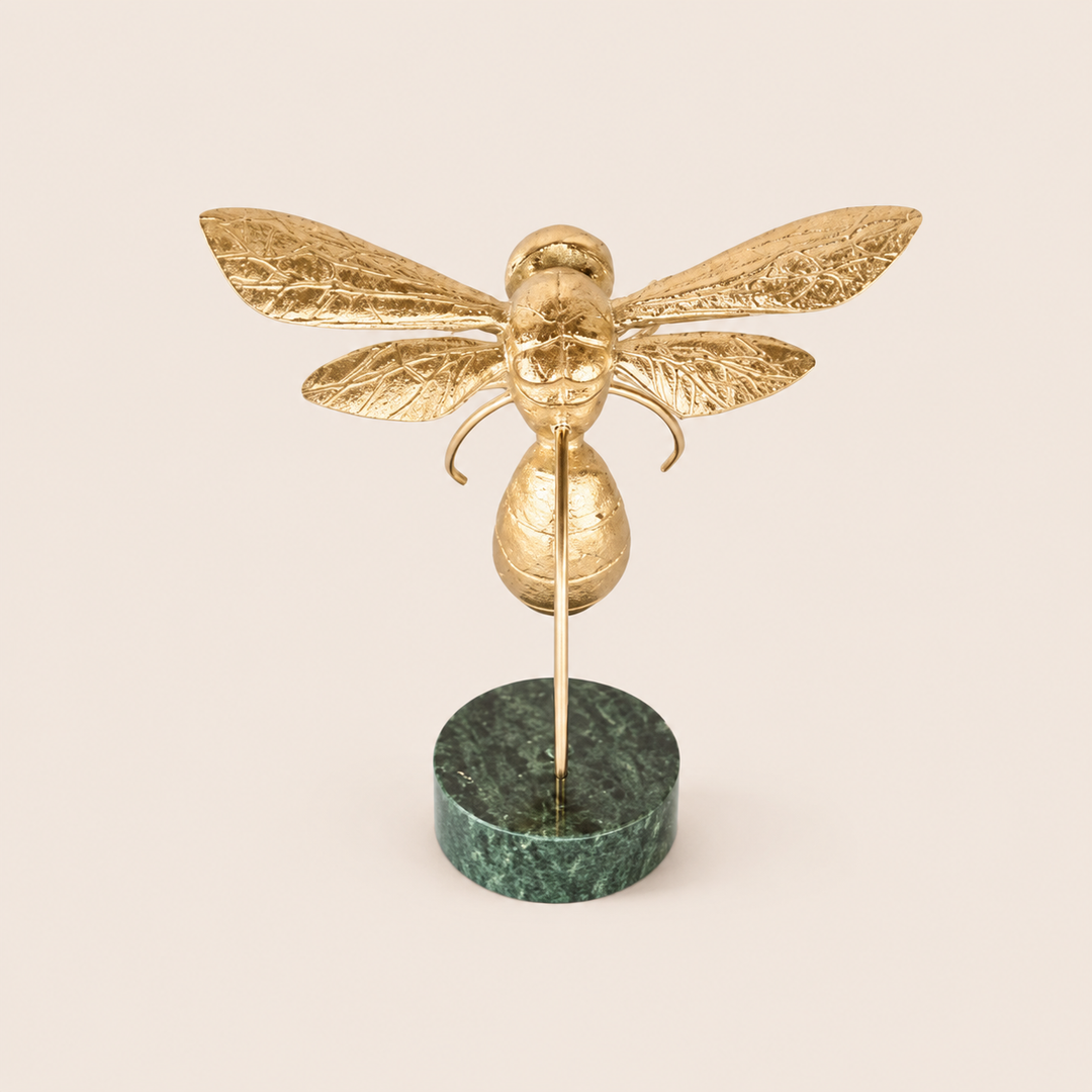 Medium gold bumblebee on dark green marble base – catalogue view