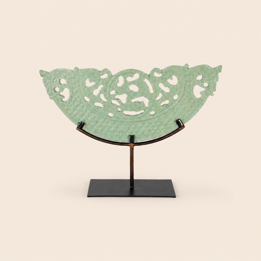 Medium green cut-out sandstone sculpture on metal stand – catalogue view