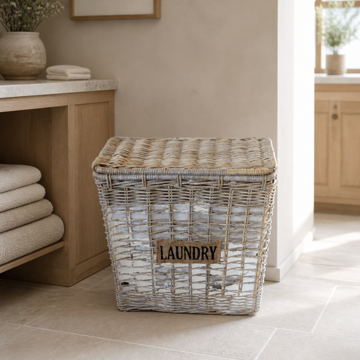 Natural laundry basket with liner in luxury laundry room