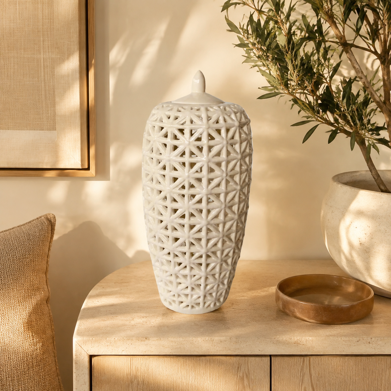 Tall white criss-cross cut-out jar with lid in warm luxury interior