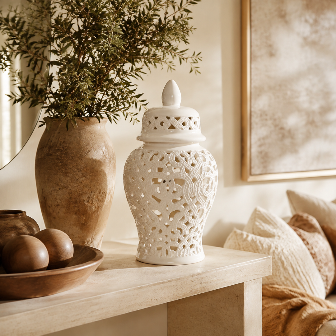 White cut-out ginger jar with braided design in warm luxury interior