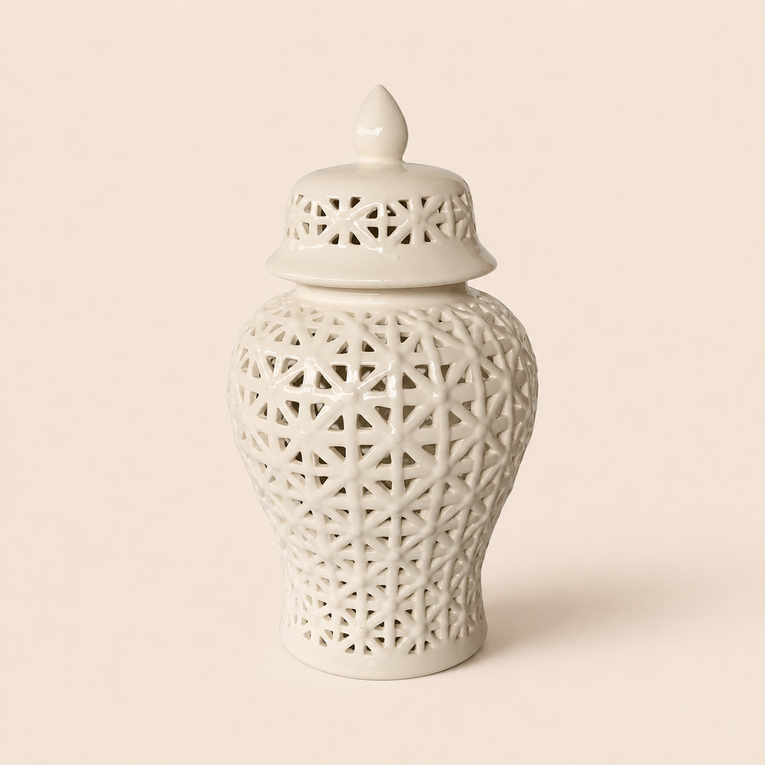 White criss-cross cut-out ginger jar on warm beige background