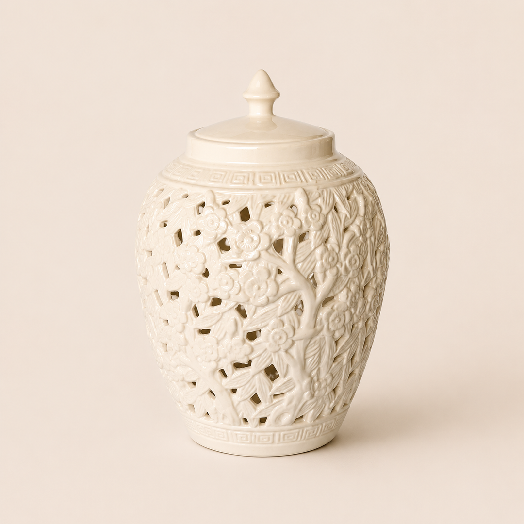 White flower and leaf cut-out barrel jar with lid on warm beige background