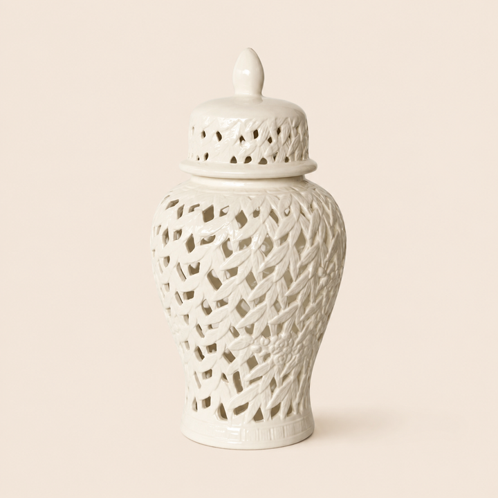 White flower and leaf cut-out ginger jar on warm beige background