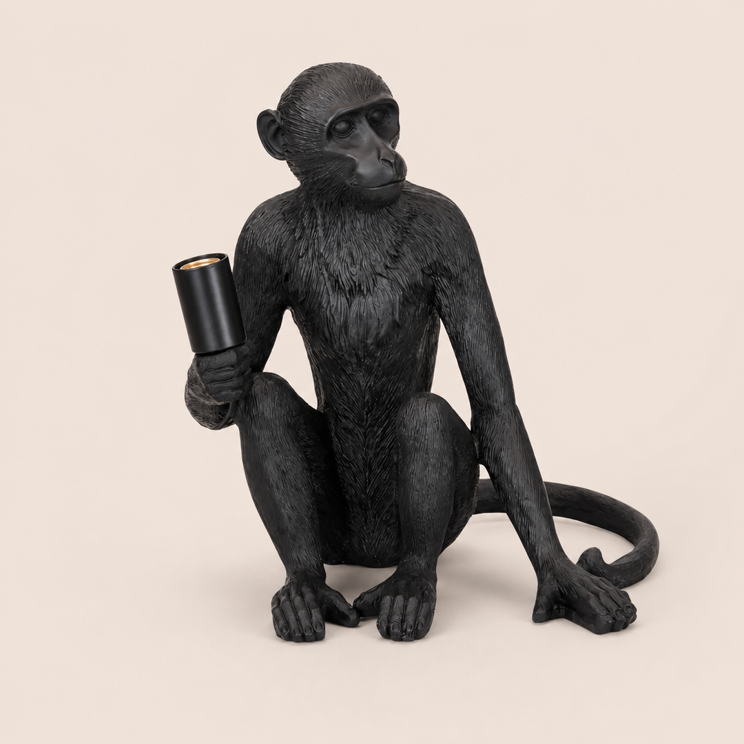 XL black resin monkey lamp excluding globe on warm beige background