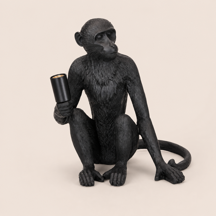 XL black resin monkey lamp excluding globe on warm beige background