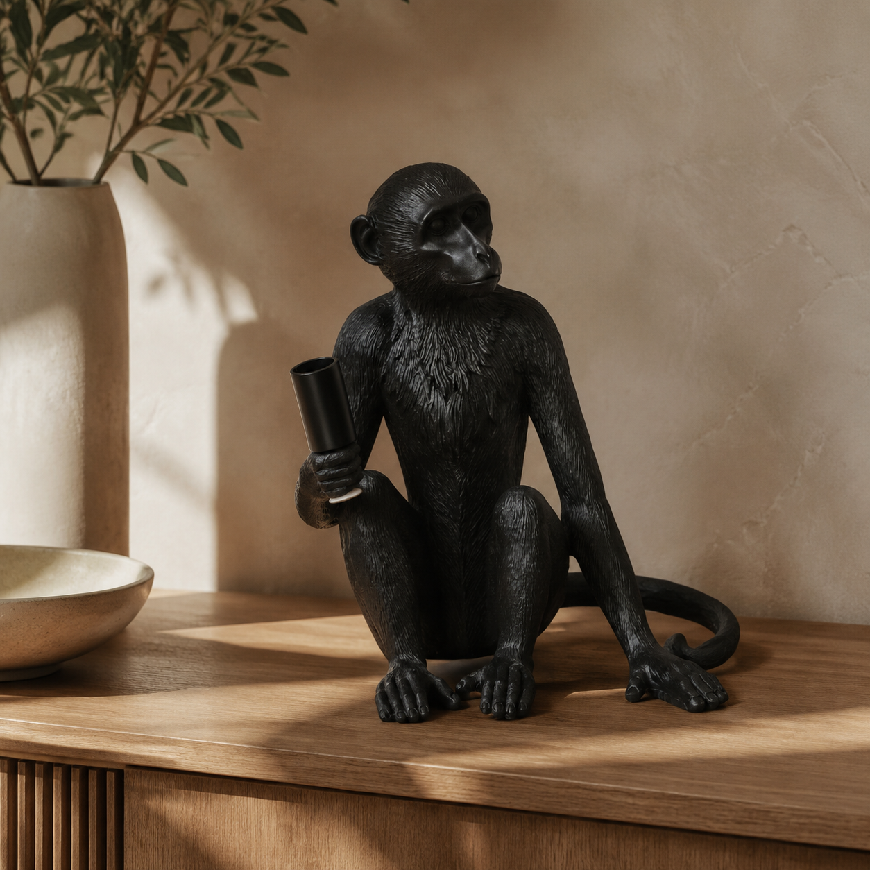 XL black resin monkey lamp excluding globe in warm luxury interior