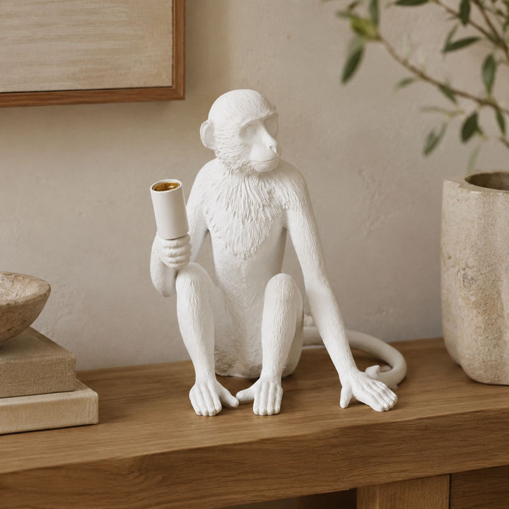 XL white resin monkey lamp excluding globe in warm luxury interior