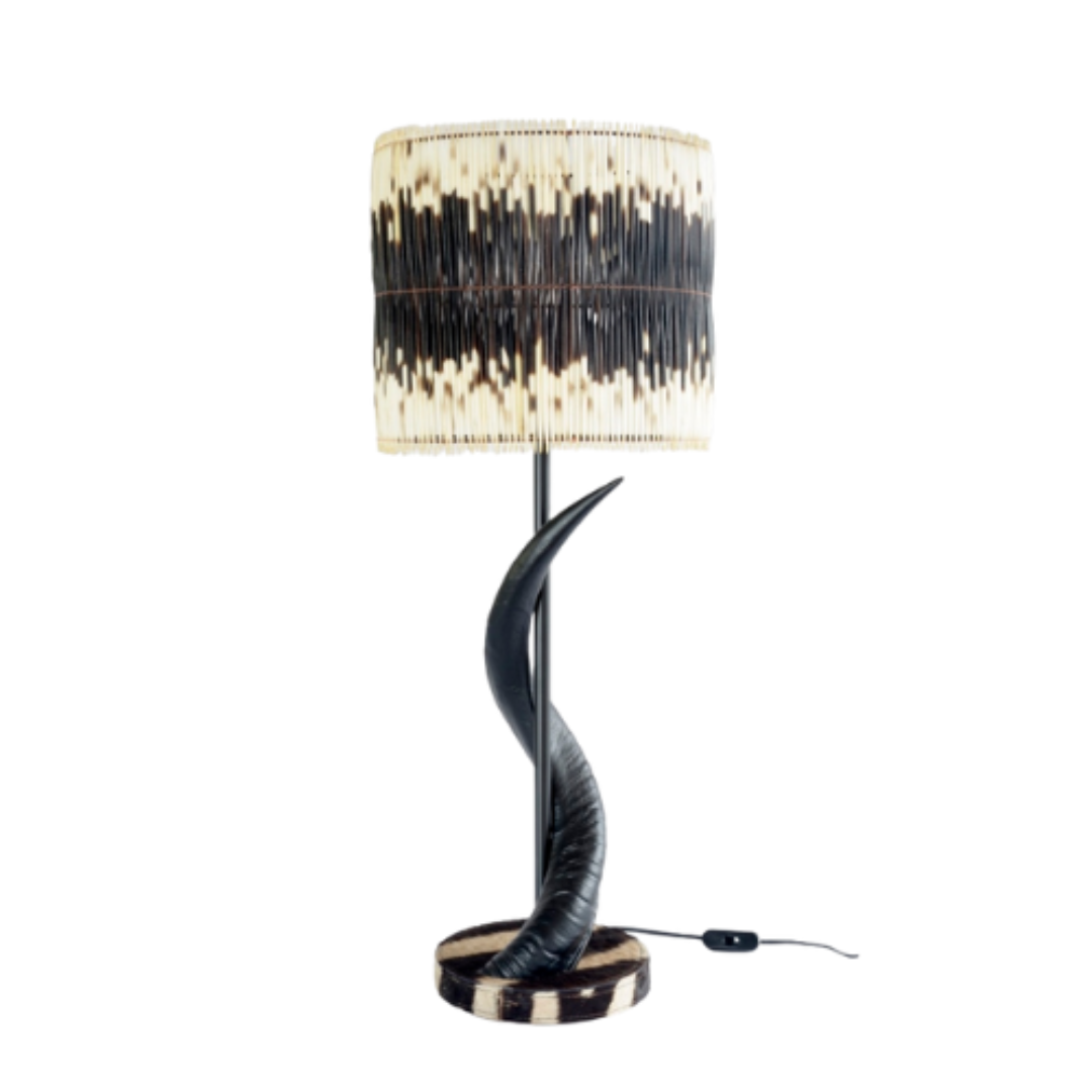 Unique Black Kudu Horn Lamp
Elevate your home decor with the majestic beauty of African wildlife. This exquisite lamp features intricately crafted black kudu horns set atop a striking zebra base, paired with two rows of natural quill shades that add warmth and texture to any room. Unique Boys.