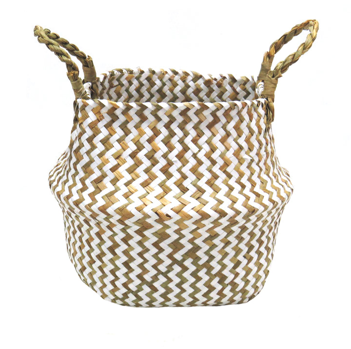 Product Details: Persell Basket
Description: A unique and beautifully finished basket featuring chevron weaving in white and natural colors.
Material: Natural fibers with twisted handles
Size: 22cm x 28cm x 24cm
Features:
Chevron weaving pattern
Natural twisted handles for a secure grip
Uses:
Outdoor decor: Add a touch of natural elegance to your patio, garden, or pool area.
Storage: Perfect for storing books, magazines, or other small items.
Store: Unique Boys, offering trendy decor that stays forever in s